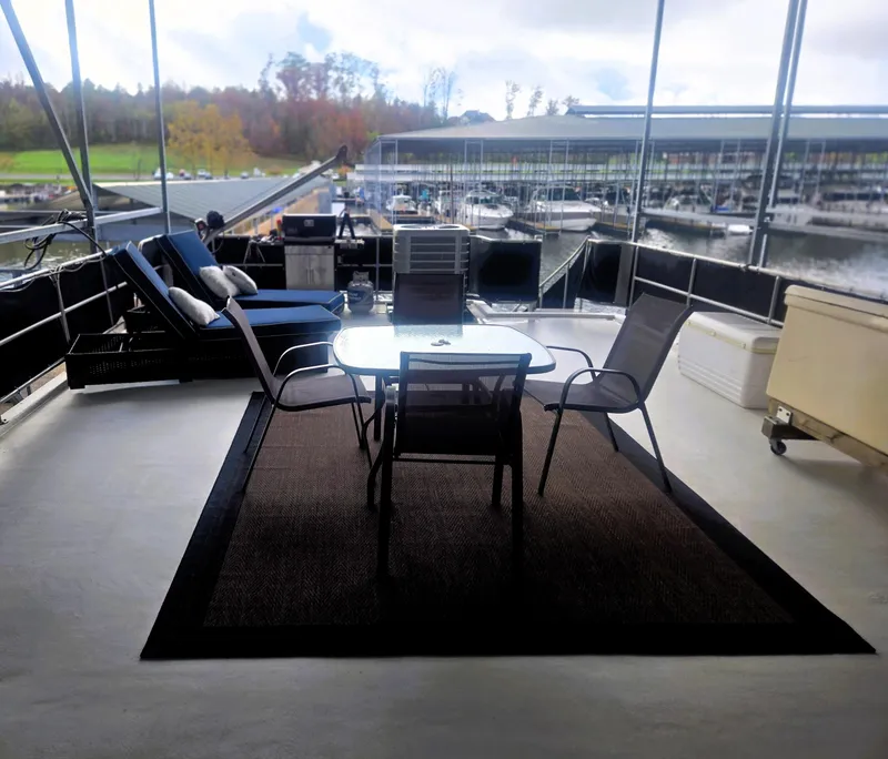Slide: The Image of Outdoor seating area on 1996 Sumerset 82'x 18' Widebody Houseboat, overlooking marina. - 9