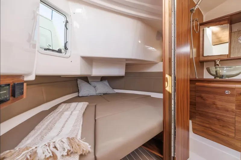 Slide: The Image of Luxurious interior of 2026 Solara S-310 Sport Coupe with cozy cabin and modern bathroom. - 14