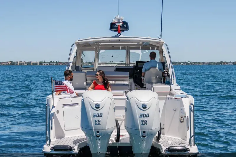 Slide: The Image of 2026 Solara S-310 Sport Coupe cruising on open water with passengers enjoying the ride. - 16
