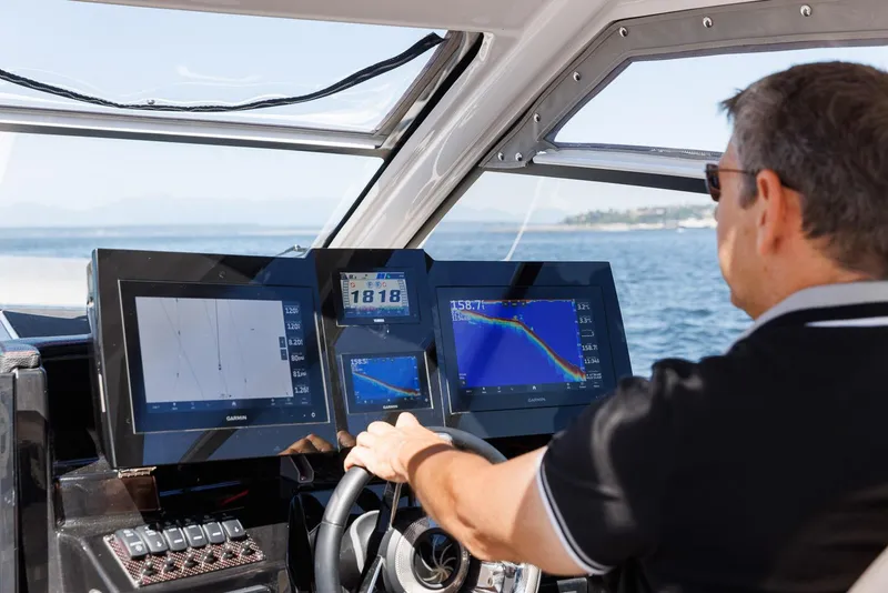 Slide: The Image of Man steering 2026 Solara S-310 Sport Coupe with advanced navigation displays. - 3