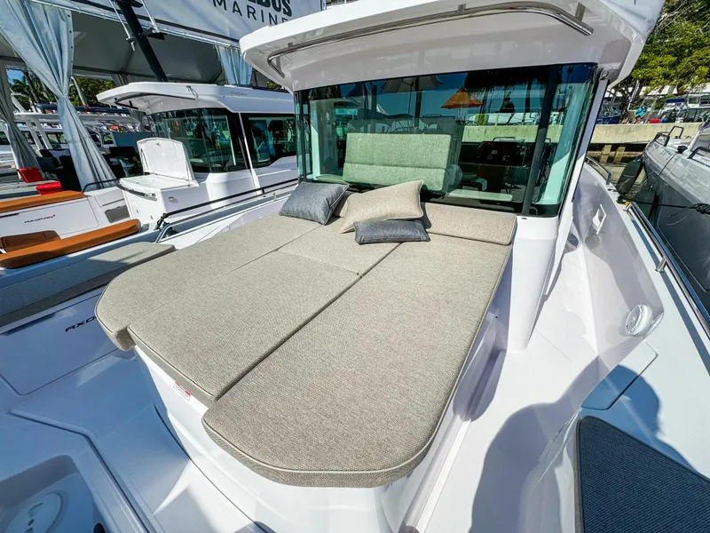 Slide: The Image of 2024 Axopar 37XC CROSS CABIN with spacious sunbed and cushions on deck. - 21