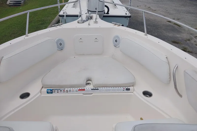 Slide: The Image of 2008 Wellcraft 220 Sportsman boat interior with white seating and stainless steel railings. - 3