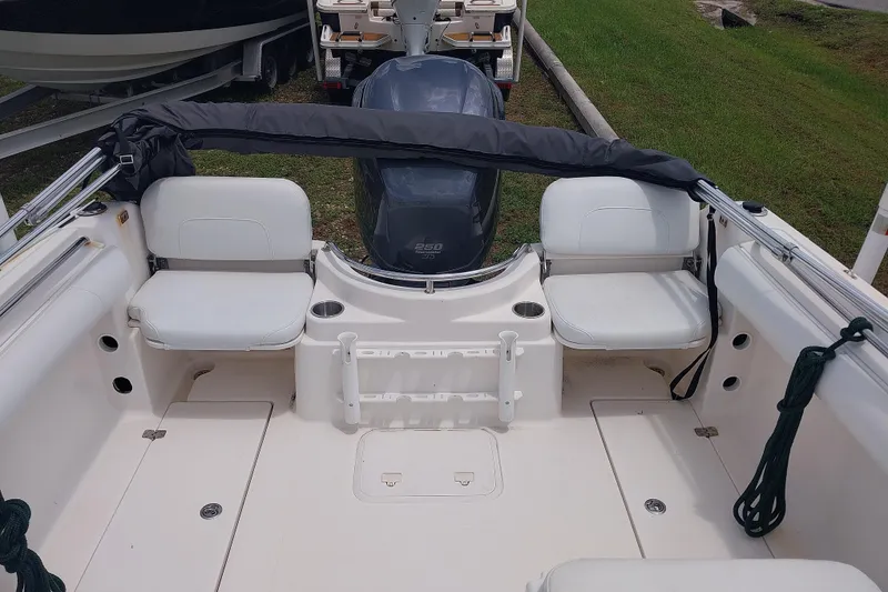 Slide: The Image of 2008 Wellcraft 220 Sportsman boat interior with seating and motor view. - 4