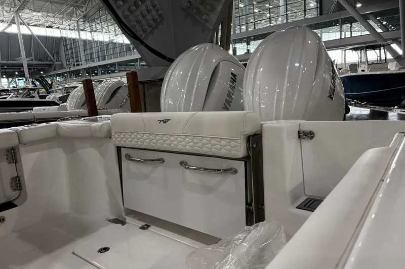 Slide: The Image of 2026 Tidewater 256 CC Adventure boat interior with luxurious seating and modern steering wheel. - 10