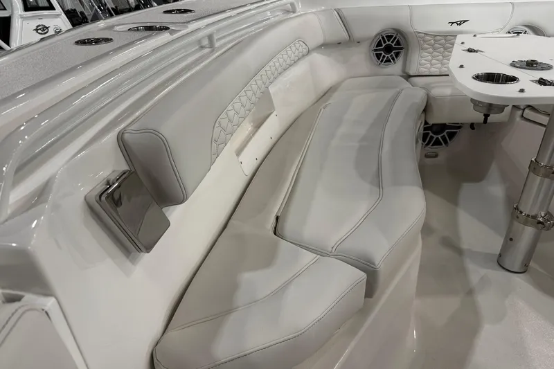 Slide: The Image of 2026 Tidewater 256 CC Adventure boat interior with Yamaha engines in a showroom. - 11