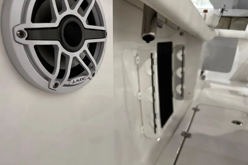 Slide: The Image of 2026 Tidewater 256 CC Adventure boat with luxurious white seating and modern design. - 15