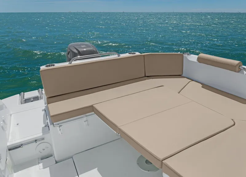Slide: The Image of 2025 Beneteau Antares 7 boat with beige seating, ocean view. - 3