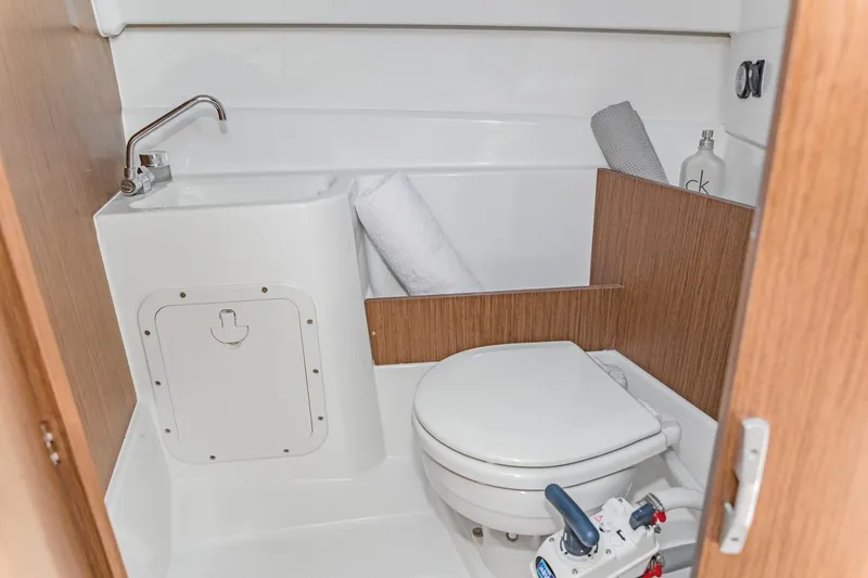 Slide: The Image of 2025 Beneteau Antares 7 boat bathroom with sink and toilet. - 4