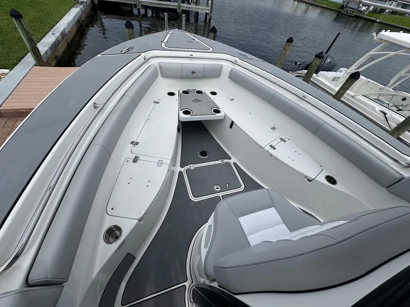 Slide: The Image of 2020 Sea Pro 259 Center Console boat interior with seating and storage compartments. - 23
