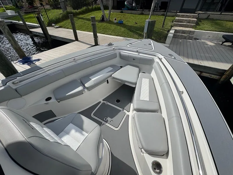 Slide: The Image of 2020 Sea Pro 259 Center Console boat interior with cushioned seating and deck view. - 27