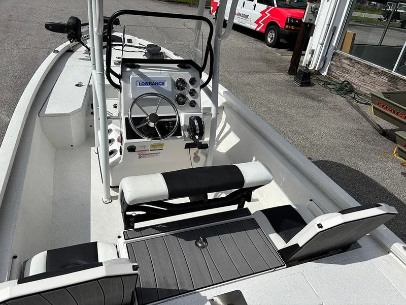 Slide: The Image of 2022 Vexus AVX1980CC boat interior with steering console and seating. - 10