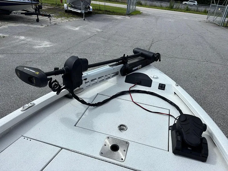 Slide: The Image of 2022 Vexus AVX1980CC boat with Minn Kota trolling motor on deck. - 12