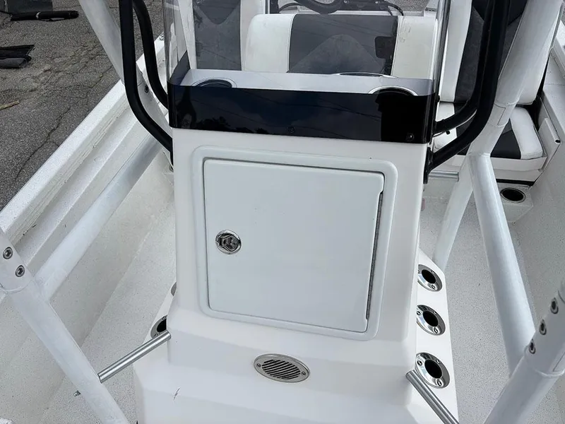 Slide: The Image of 2022 Vexus AVX1980CC boat console with storage compartment and cup holders. - 18