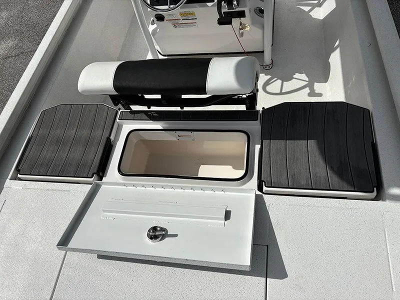 Slide: The Image of 2022 Vexus AVX1980CC boat interior with storage compartments and seating. - 23