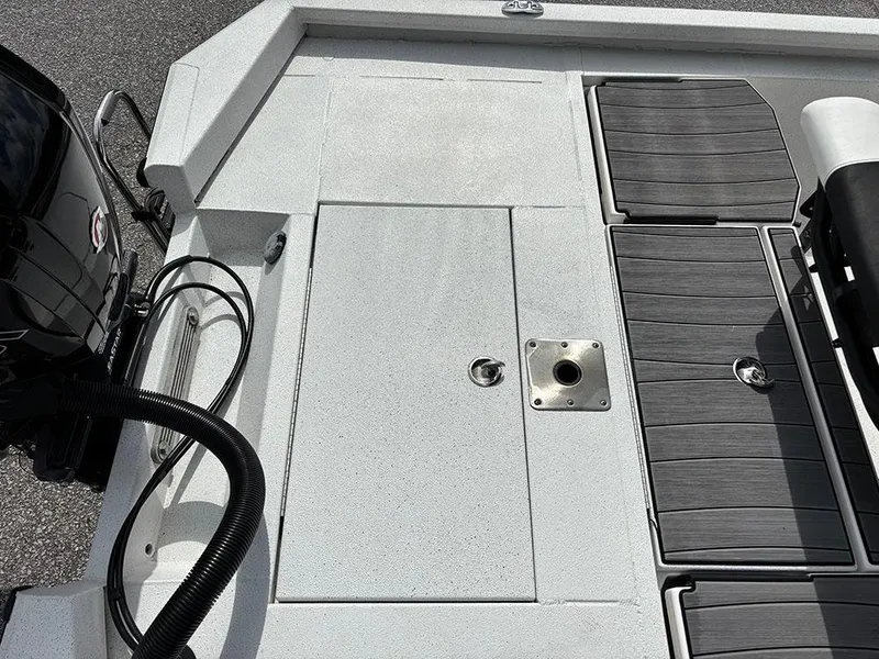 Slide: The Image of 2022 Vexus AVX1980CC boat deck with motor and seating area. - 24