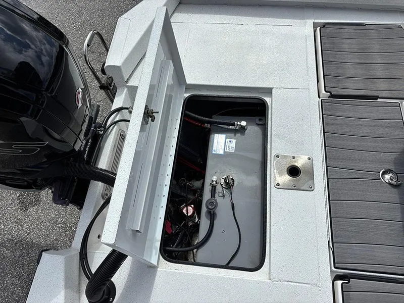 Slide: The Image of 2022 Vexus AVX1980CC boat showing open battery compartment and engine details. - 25