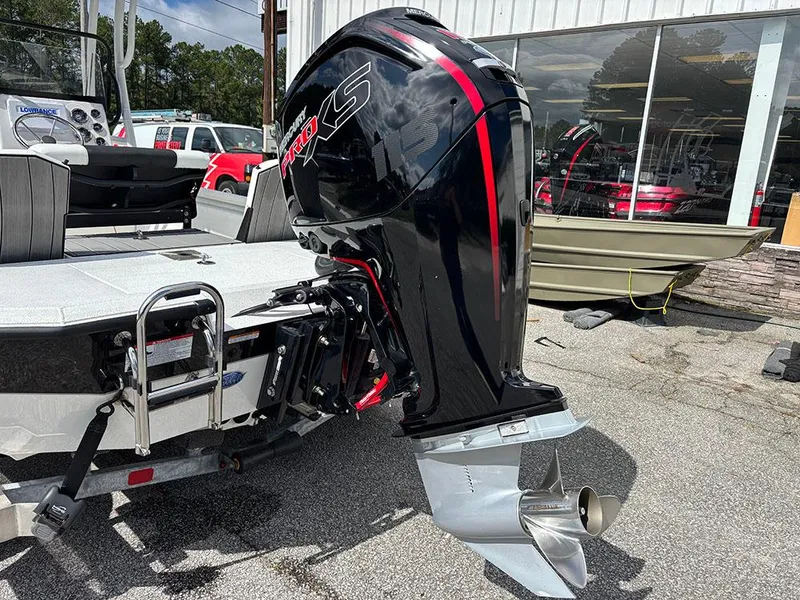 Slide: The Image of 2022 Vexus AVX1980CC boat with powerful outboard motor, parked outdoors. - 27