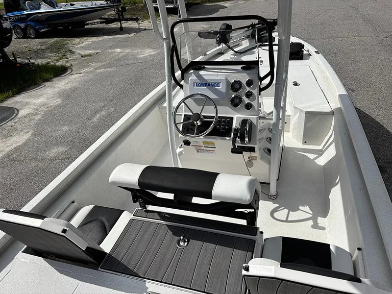 Slide: The Image of 2022 Vexus AVX1980CC boat interior with steering console and seating. - 9