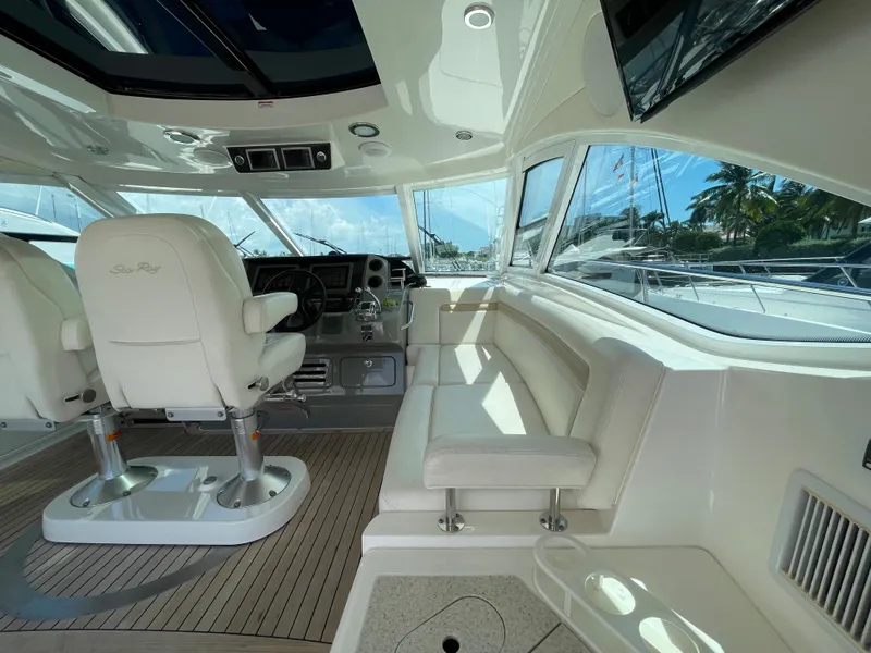 Slide: The Image of Luxurious interior of 2010 Sea Ray 540 Sundancer yacht with plush seating and modern helm. - 14