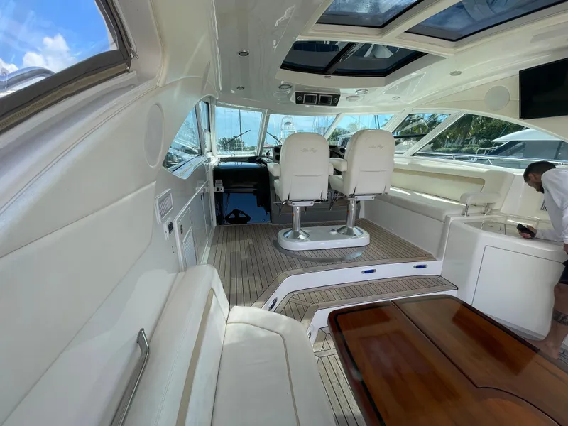 Slide: The Image of Interior of 2010 Sea Ray 540 Sundancer yacht with luxurious seating and helm. - 15