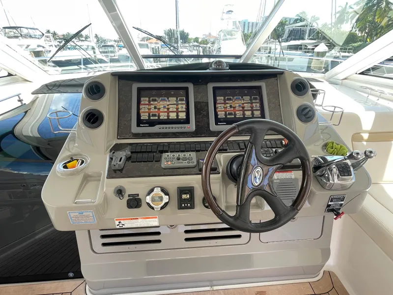 Slide: The Image of Helm of 2010 Sea Ray 540 Sundancer with dual displays and steering wheel. - 21