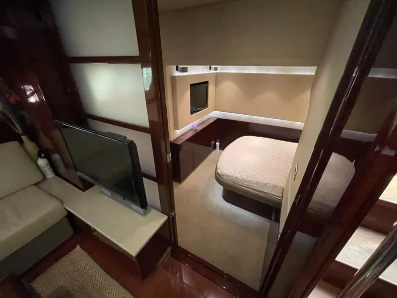 Slide: The Image of Interior of 2010 Sea Ray 540 Sundancer yacht with cozy bedroom and TV area. - 27