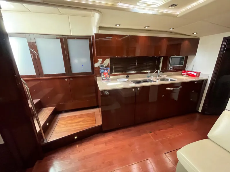 Slide: The Image of Luxurious interior of 2010 Sea Ray 540 Sundancer yacht with modern kitchen amenities. - 33