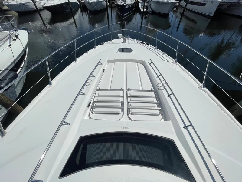 Slide: The Image of 2010 Sea Ray 540 Sundancer yacht deck view at marina. - 6
