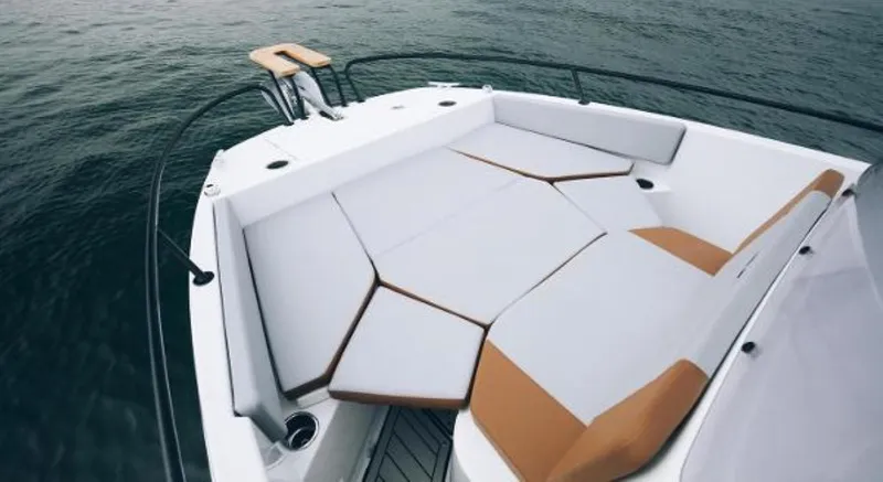 Slide: The Image of 2025 Beneteau Flyer 7 SPACEdeck boat with spacious seating area on calm water. - 12