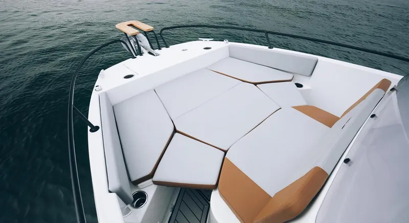 Slide: The Image of 2025 Beneteau Flyer 7 SPACEdeck boat with spacious seating on calm water. - 4