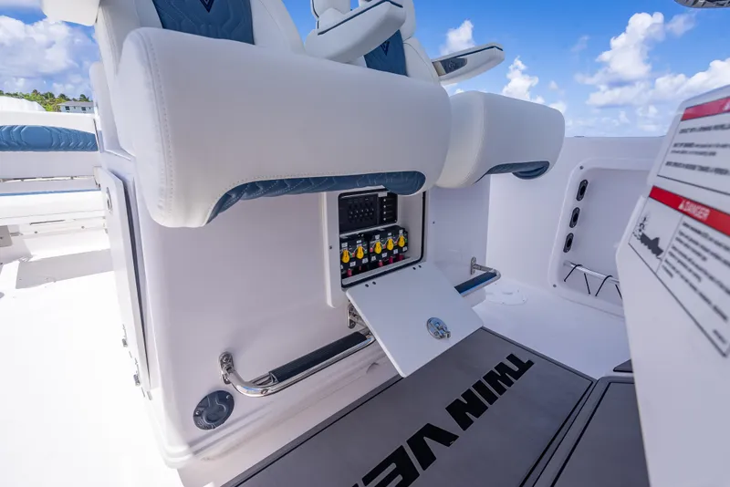 Slide: The Image of 2026 Twin Vee 260 GFX2 CC boat interior with control panel and seating. - 40