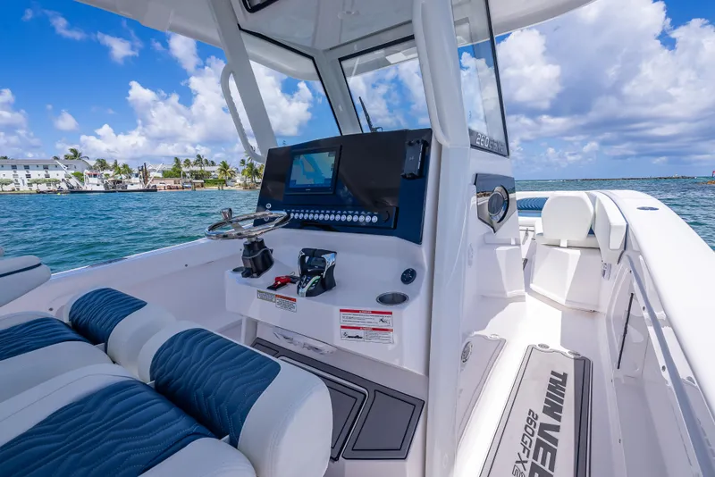 Slide: The Image of 2026 Twin Vee 260 GFX2 CC boat interior with modern dashboard and seating. - 43
