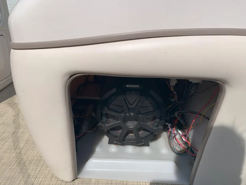 Slide: The Image of 2007 Sun Tracker Party Barge 22 speaker system with wiring inside compartment. - 9