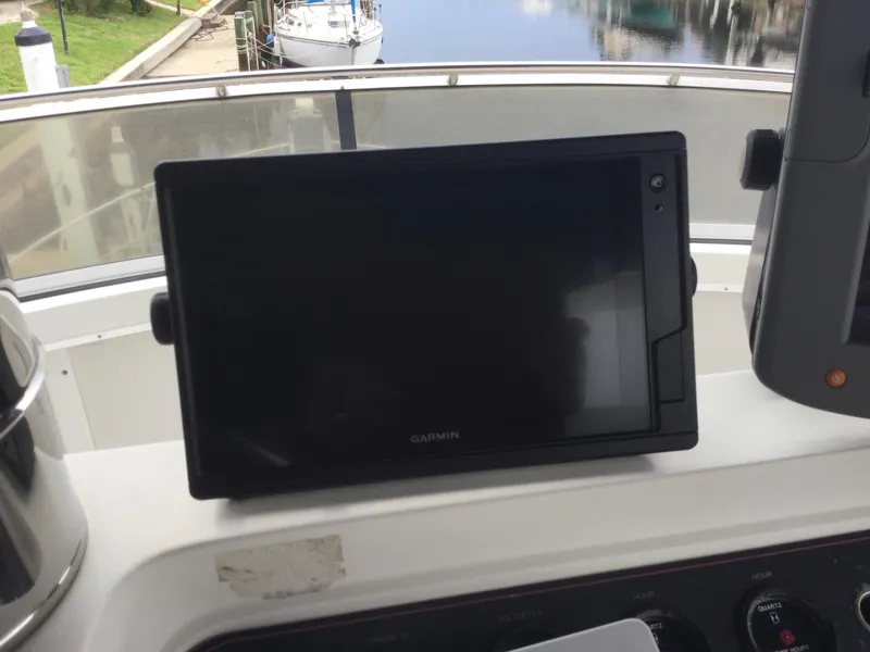 Slide: The Image of Garmin navigation system on 1995 Carver 430 Cockpit Motor Yacht dashboard. - 11