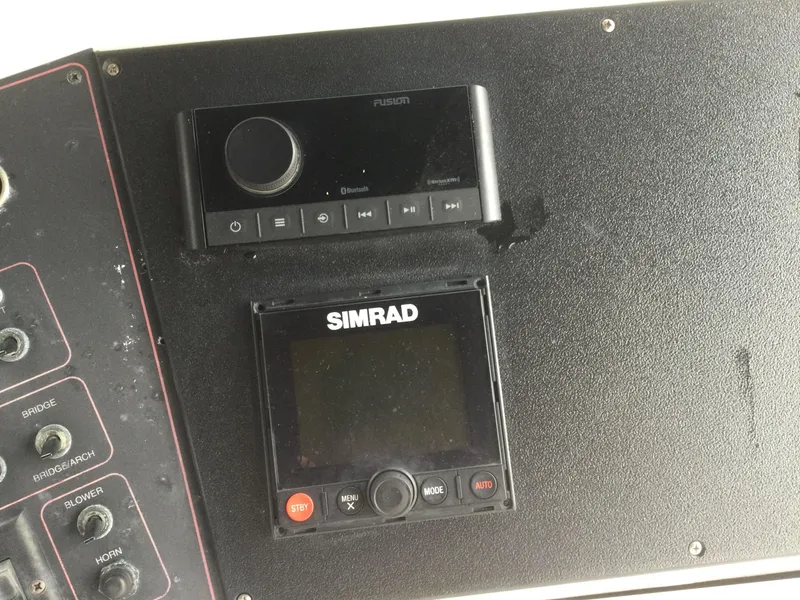 Slide: The Image of Control panel of 1995 Carver 430 Cockpit Motor Yacht with Simrad and Fusion devices. - 20