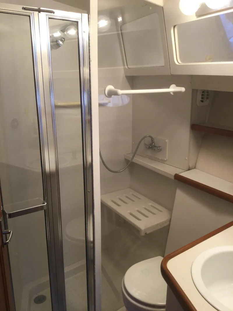 Slide: The Image of Bathroom interior of 1995 Carver 430 Cockpit Motor Yacht with shower and toilet. - 35
