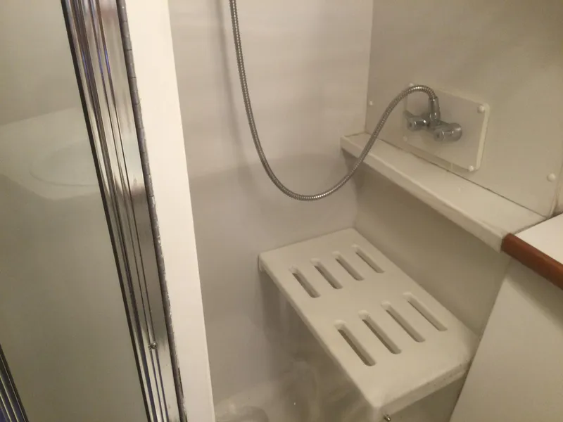 Slide: The Image of Shower area in 1995 Carver 430 Cockpit Motor Yacht with bench and handheld showerhead. - 36