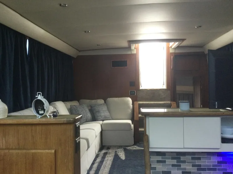 Slide: The Image of Interior of 1995 Carver 430 Cockpit Motor Yacht with cozy seating and modern decor. - 41