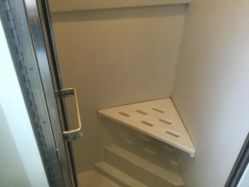 Slide: The Image of Shower area inside 1995 Carver 430 Cockpit Motor Yacht, featuring a corner seat. - 46