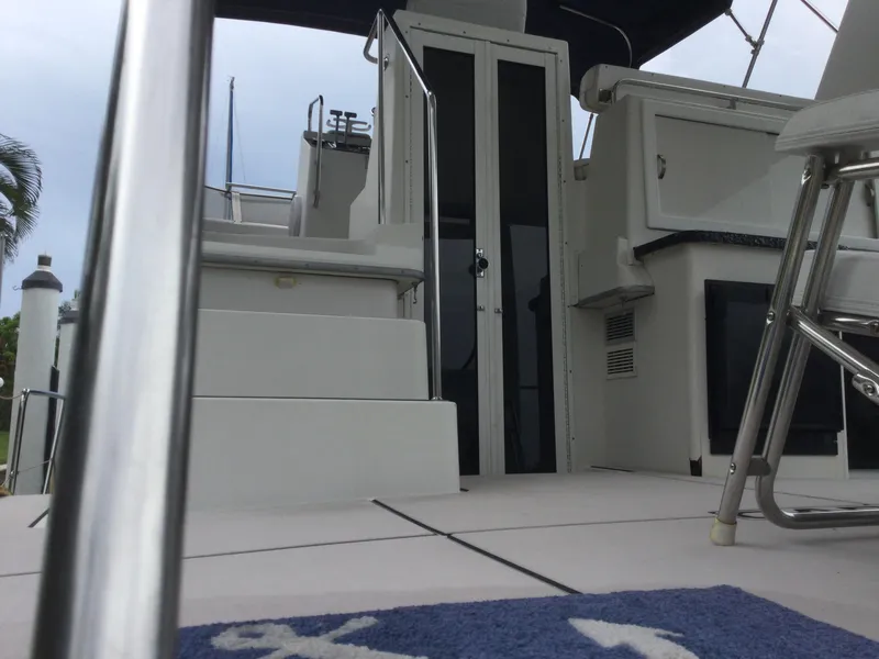 Slide: The Image of 1995 Carver 430 Cockpit Motor Yacht interior with stairs and seating area. - 6