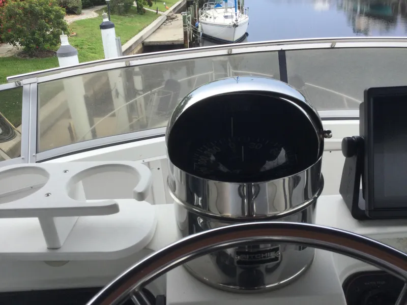 Slide: The Image of 1995 Carver 430 Cockpit Motor Yacht helm with compass and navigation equipment. - 9