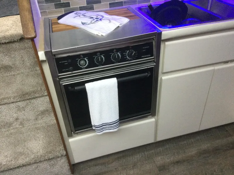 Slide: The Image of 1995 Carver 430 Cockpit Motor Yacht kitchen with oven and sink. - 30