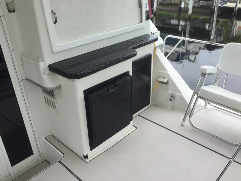 Slide: The Image of 1995 Carver 430 Cockpit Motor Yacht interior with seating and storage. - 5