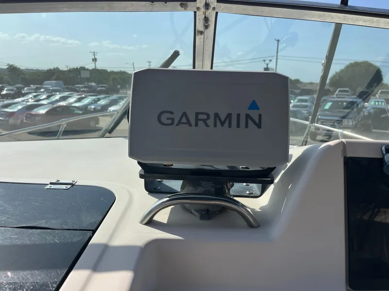 Slide: The Image of Garmin navigation system on 1997 Grady-White 232 Gulfstream boat dashboard. - 13