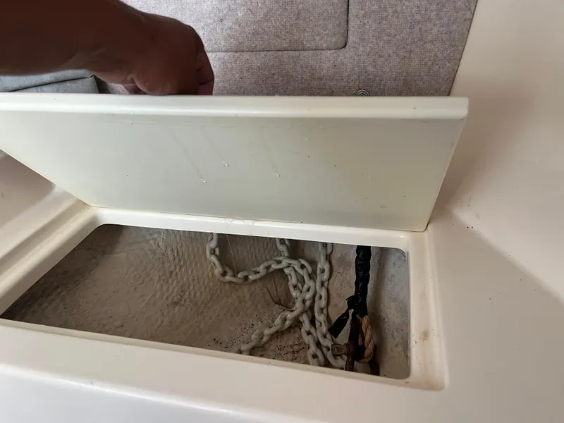 Slide: The Image of Anchor chain compartment on a 1997 Grady-White 232 Gulfstream boat. - 15