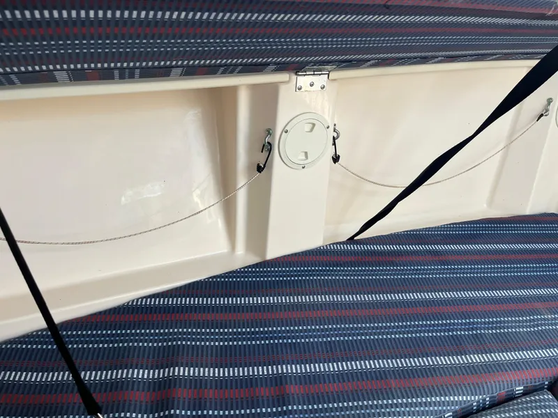 Slide: The Image of Interior of 1997 Grady-White 232 Gulfstream boat with striped seating. - 18