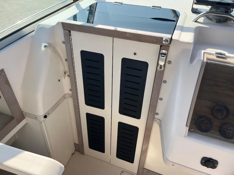 Slide: The Image of Interior view of a 1997 Grady-White 232 Gulfstream boat cabin. - 24