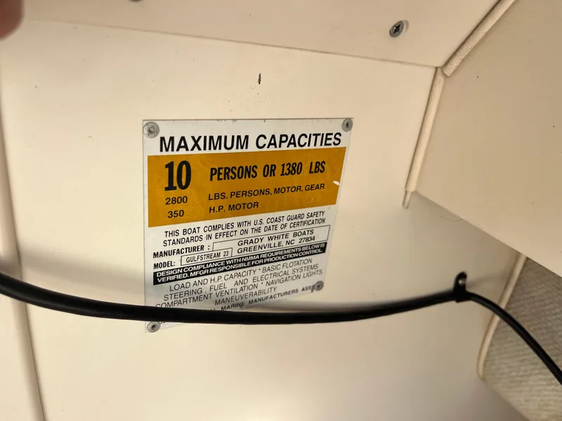 Slide: The Image of 1997 Grady-White 232 Gulfstream capacity label, 10 persons or 1380 lbs, 2800 lbs total. - 27