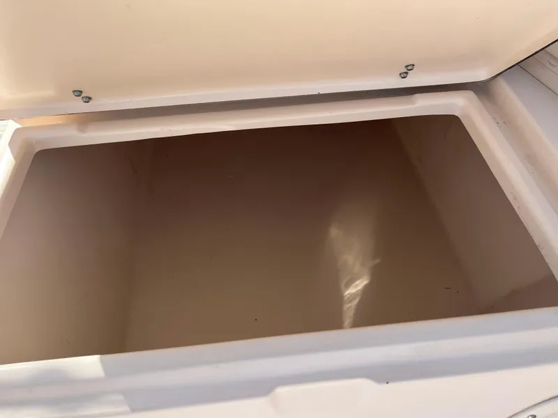 Slide: The Image of Open storage compartment on a 1997 Grady-White 232 Gulfstream boat. - 29
