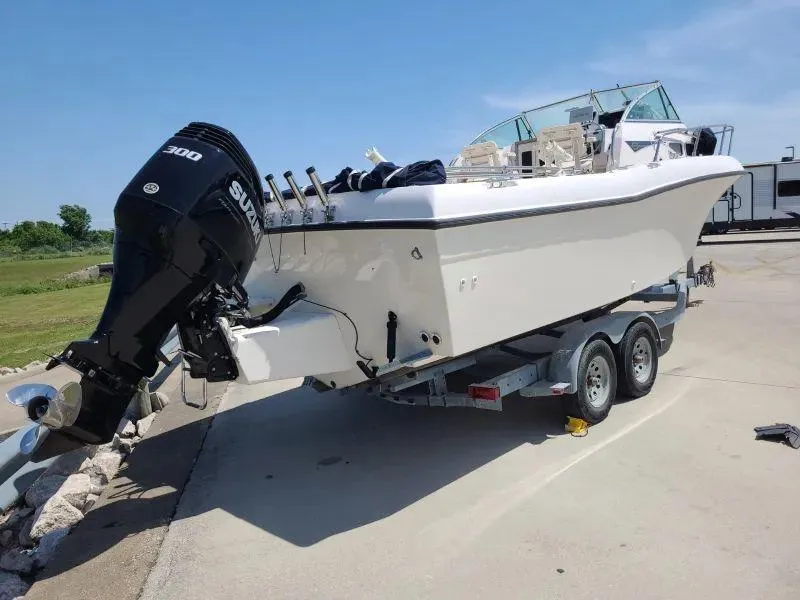 Slide: The Image of 1997 Grady-White 232 Gulfstream boat on trailer with Suzuki outboard motor. - 3
